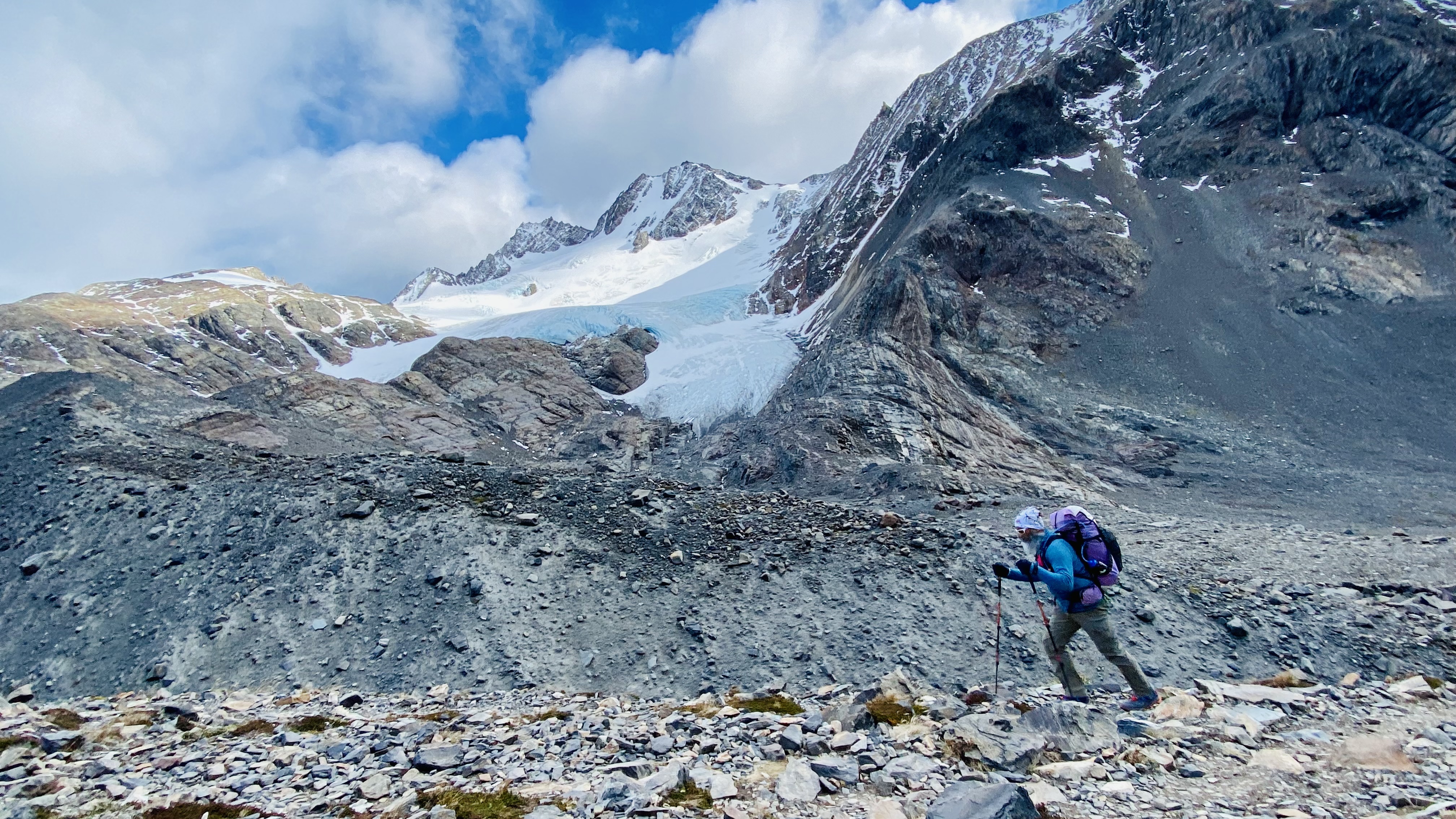 Gurpreet backpacking beneath glaciers on the Torres del Paine O Circuit in Patagonia